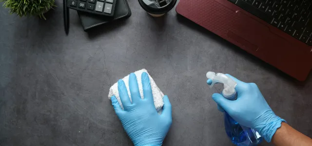 person in blue long sleeve shirt sitting beside black laptop computer by Towfiqu barbhuiya courtesy of Unsplash.