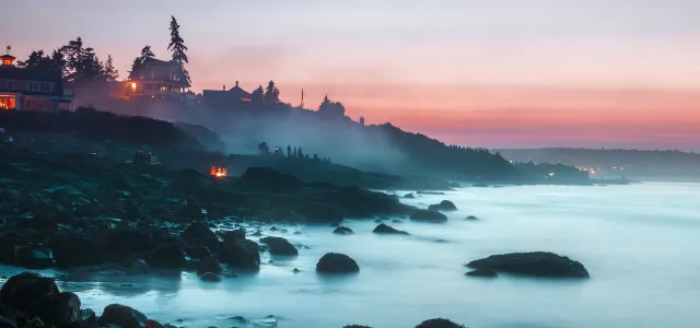 photography of house near body of water by Justin  Bisson Beck courtesy of Unsplash.